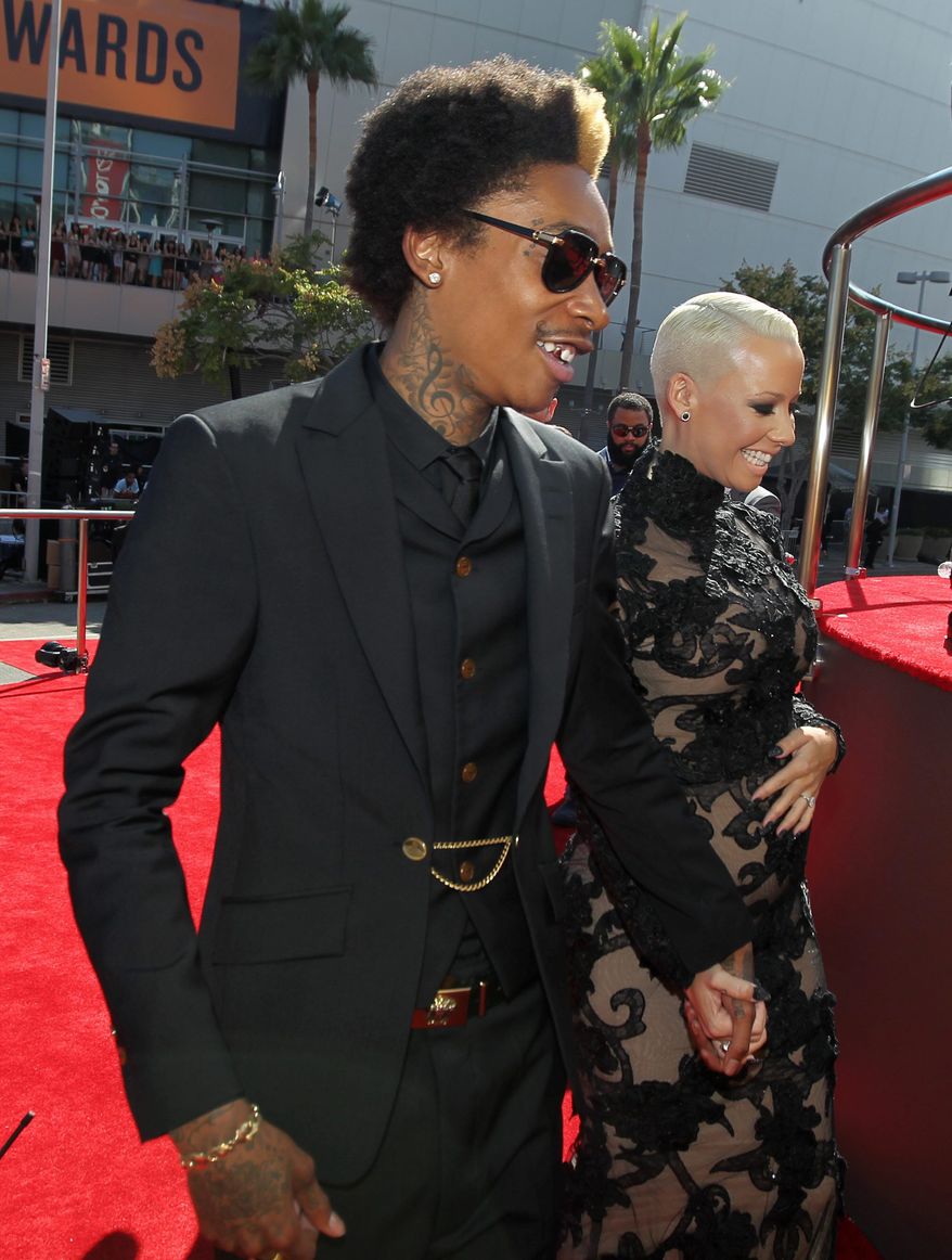 Wiz Khalifa, left, and Amber Rose arrive at the MTV Video Music Awards on Thursday, Sept. 6, 2012, in Los Angeles. (Photo by Matt Sayles/Invision/AP)