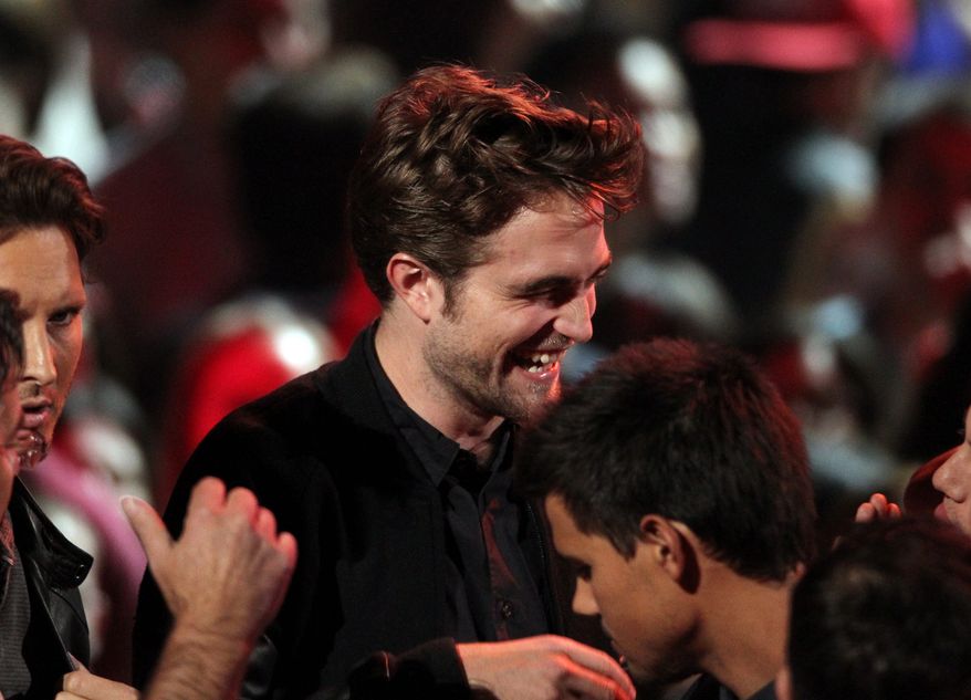 Robert Pattinson smiles onstage at the MTV Video Music Awards on Thursday, Sept. 6, 2012, in Los Angeles. (Photo by Matt Sayles/Invision/AP)