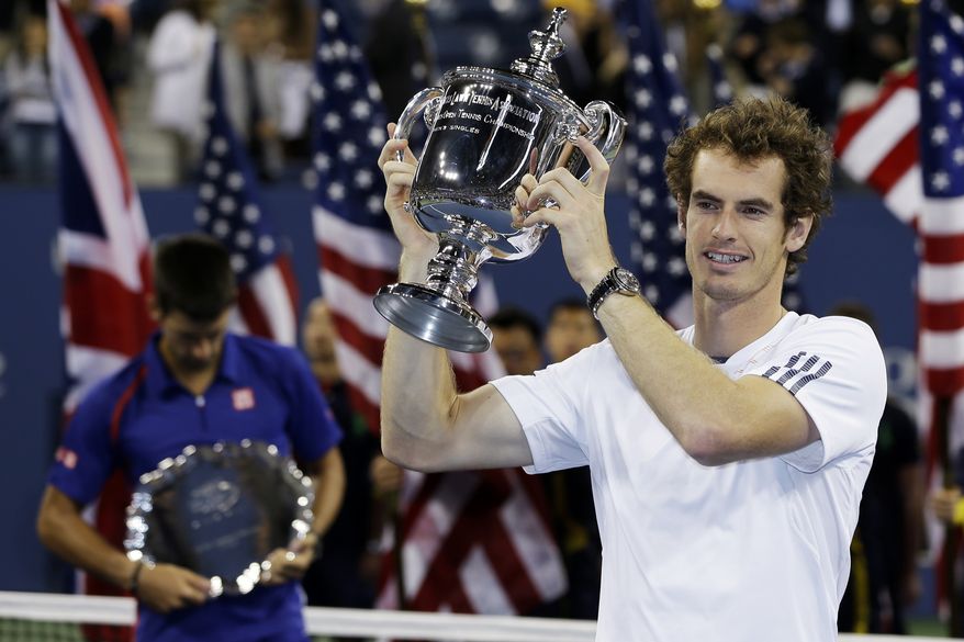 Britain's Andy Murray poses with the trophy after defeating Serbia's Novak Djokovic in the championship match at the U.S. Open tennis tournament, Monday, Sept. 10, 2012, in New York. Murray won 7-6 (10), 7-5, 2-6, 3-6, 6-2. (AP Photo/Mike Groll)