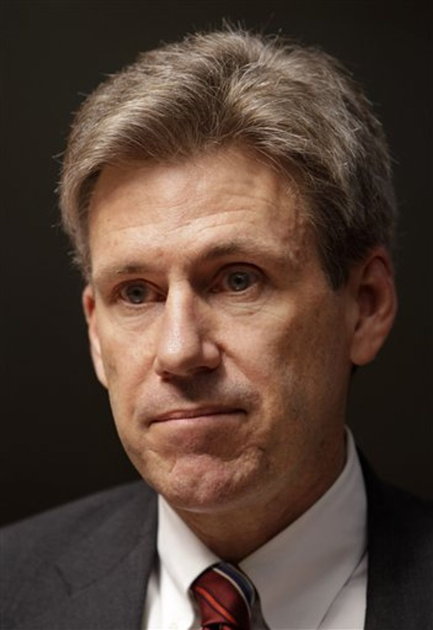 ** FILE ** In this Monday, April 11, 2011, file photo, U.S. envoy Chris Stevens stands in the lobby of the Tibesty Hotel where an African Union delegation was meeting with opposition leaders in Benghazi, Libya. (AP Photo/Ben Curtis, File)