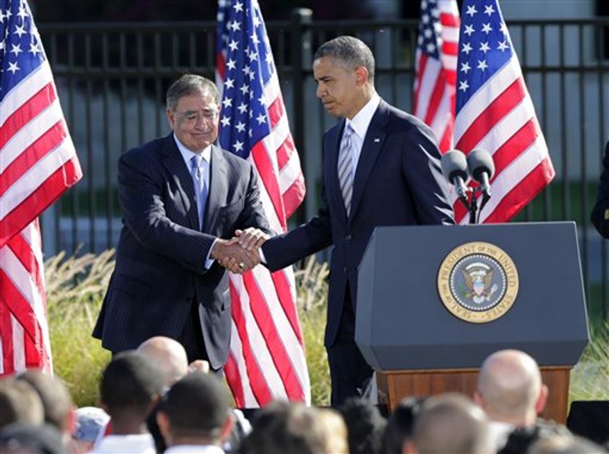Defense Secretary Leon Panetta shakes hands with President Barack Obama after the president spoke at a ceremony marking the 11th anniversary of the terrorist attacks at the Pentagon, Tuesday, Sept. 11, 2012. (AP Photo/J. Scott Applewhite)