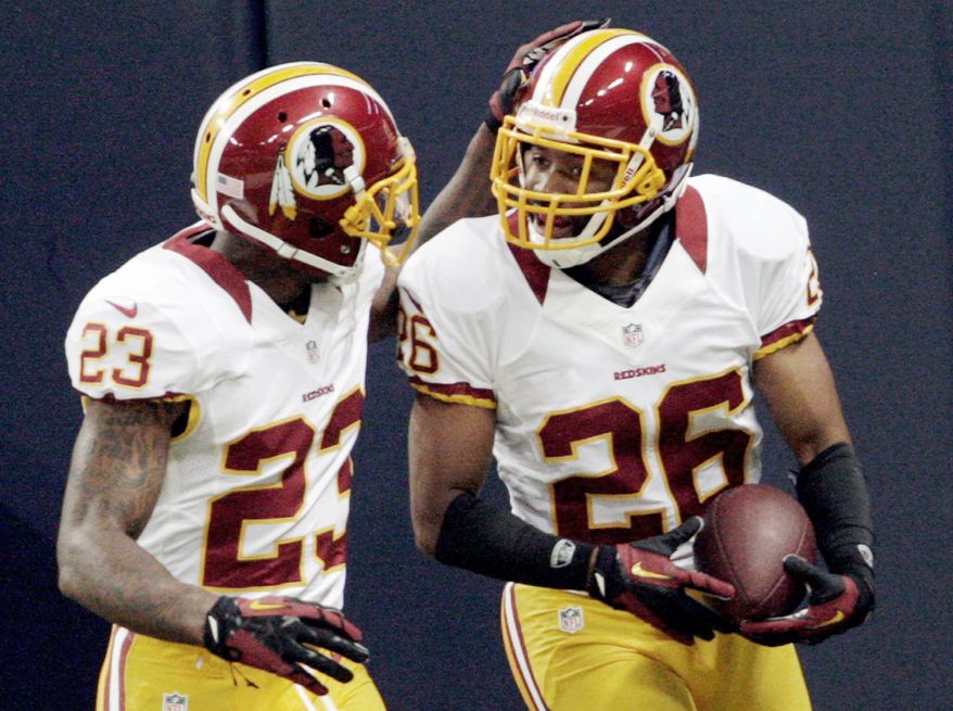 ASSOCIATED PRESS
Redskins cornerback Josh Wilson (right) is congratulated by DeAngelo Hall after returning a fumble for a touchdown during the first quarter.