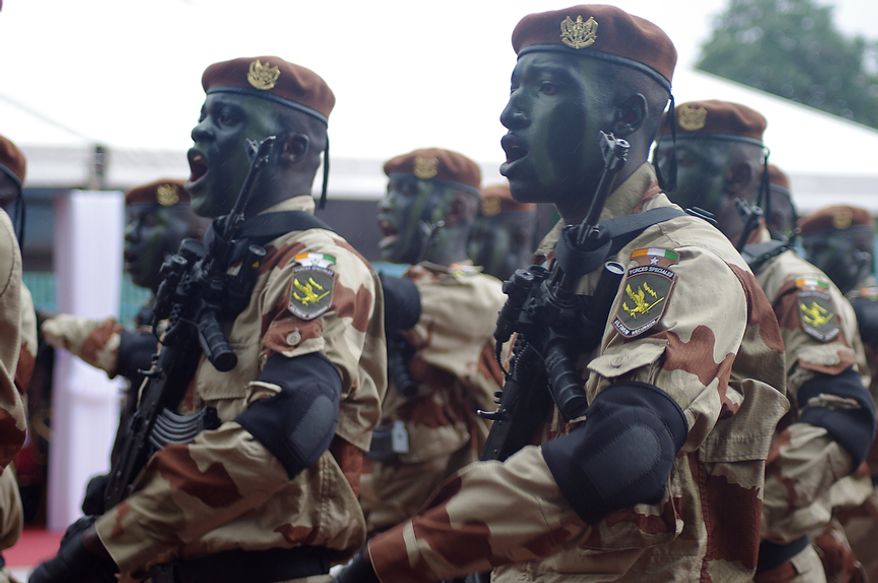 Members of Ivory Coast's armed forces march during the country's Independence Day celebrations on Tuesday, Aug. 7, 2012. (Robbie Corey-Boulet/Special to The Washington Times)