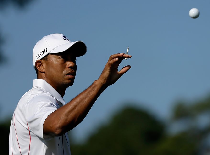 Tiger Woods catches a ball during practice for the Tour Championship golf tournament Wednesday, Sept. 19, 2012, in Atlanta. The tournament begins Thursday. (AP Photo/David Goldman)