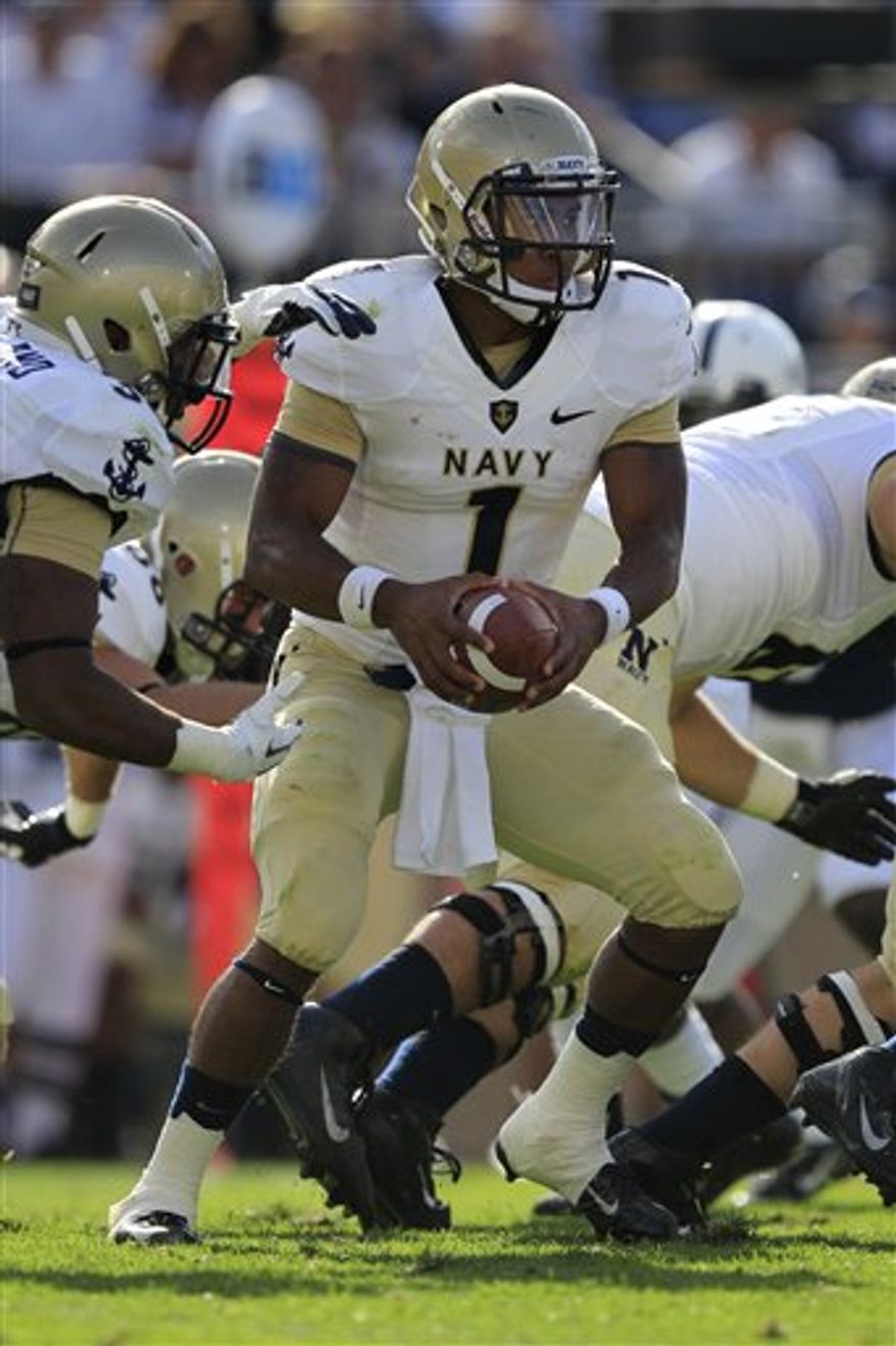 ** FILE ** Navy quarterback Trey Miller (1) plays during the second quarter of an NCAA college football game against Penn State in State College, Pa., Saturday, Sept. 15, 2012. Penn State won 34-7. (AP Photo/Gene J. Puskar)