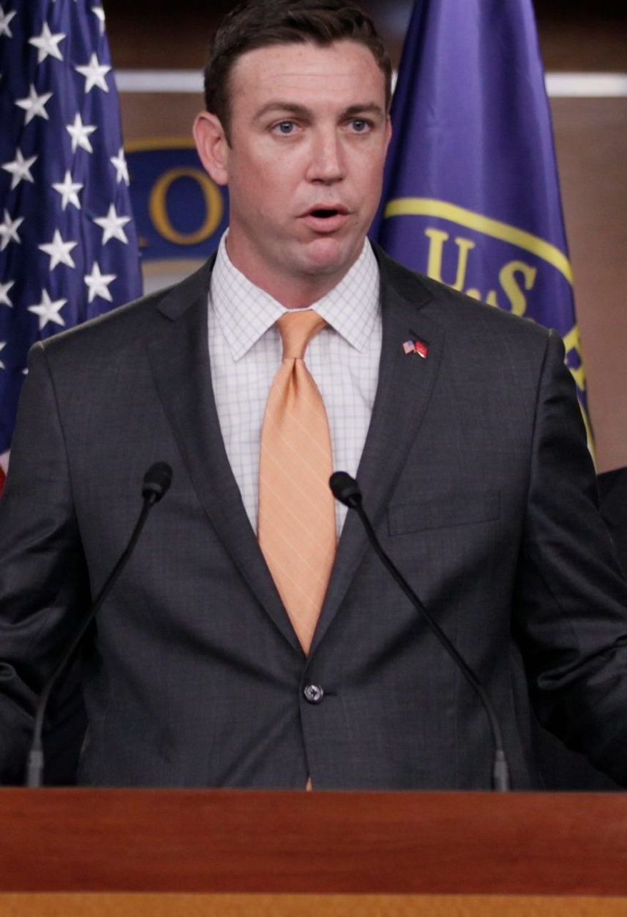 ** FILE ** Rep. Duncan Hunter, California Republican, speaks during a news conference on Capitol Hill on April 7, 2011, in Washington. (AP Photo/Carolyn Kaster)
