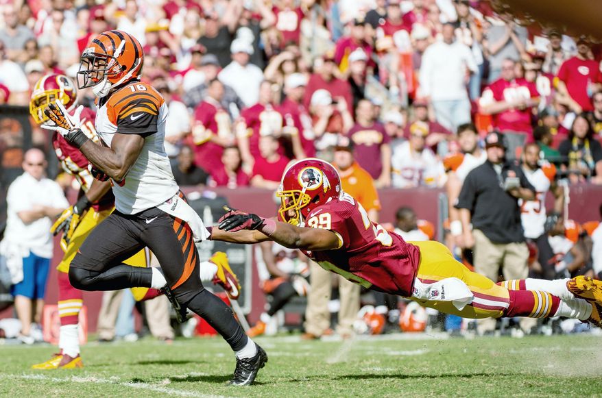 Redskins cornerback Richard Crawford lunges to no avail as Bengals wide receiver Andrew Hawkins scores on a 59-yard touchdown. The play put Cincinnati up by two touchdowns. (Andrew Harnik/The Washington Times)