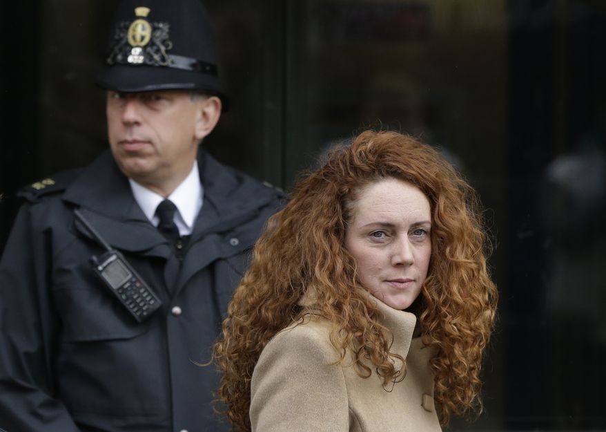 **FILE** Rebekah Brooks, the former chief of News Corp.'s British operations, leaves the Old Bailey court in London on Sept. 26, 2012. (Associated Press)