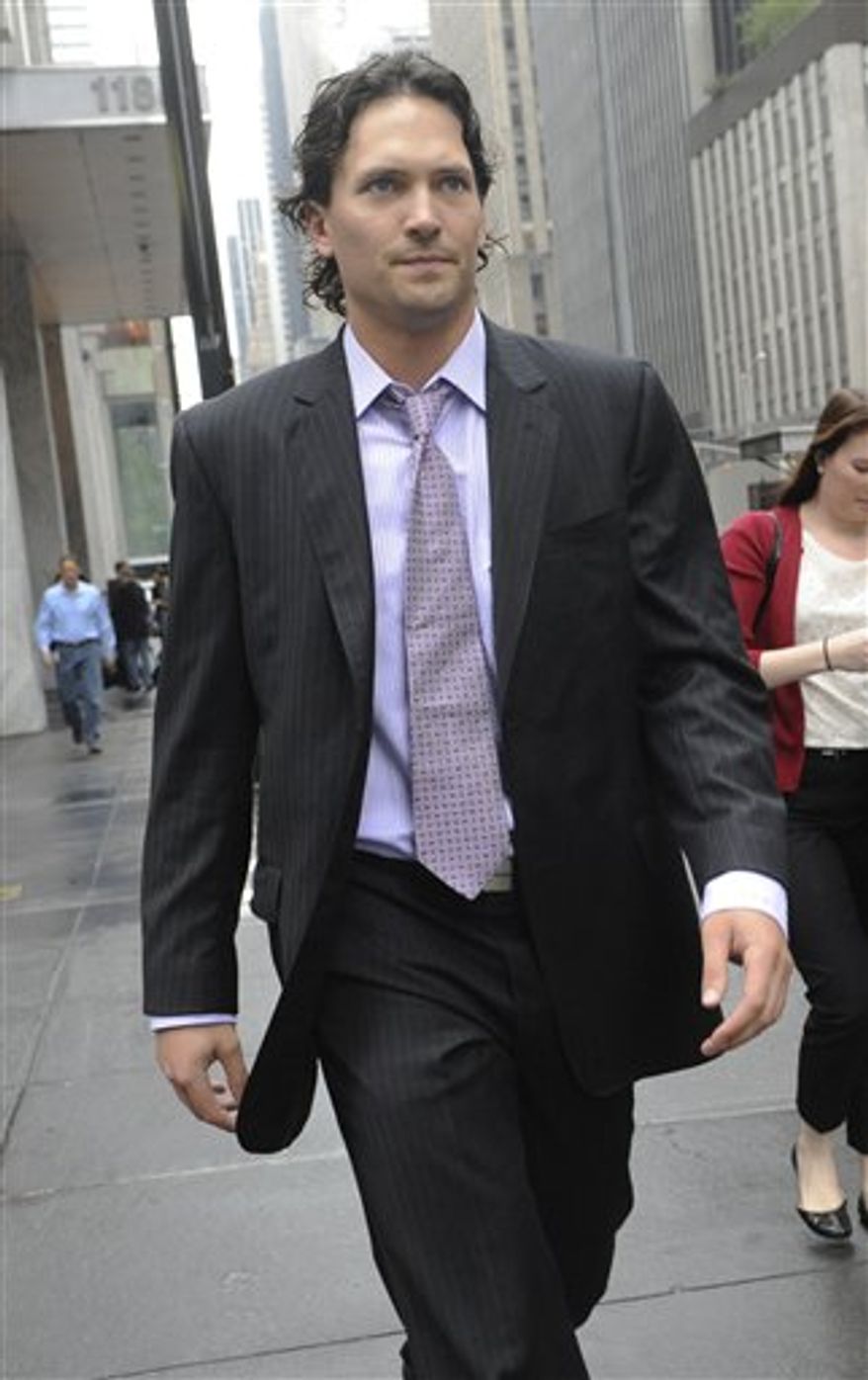 Winnipeg Jets' Ron Hainsey takes a break from a bargaining session at NHL headquarters in New York, Friday, Sept. 28, 2012. (AP Photo/Louis Lanzano)