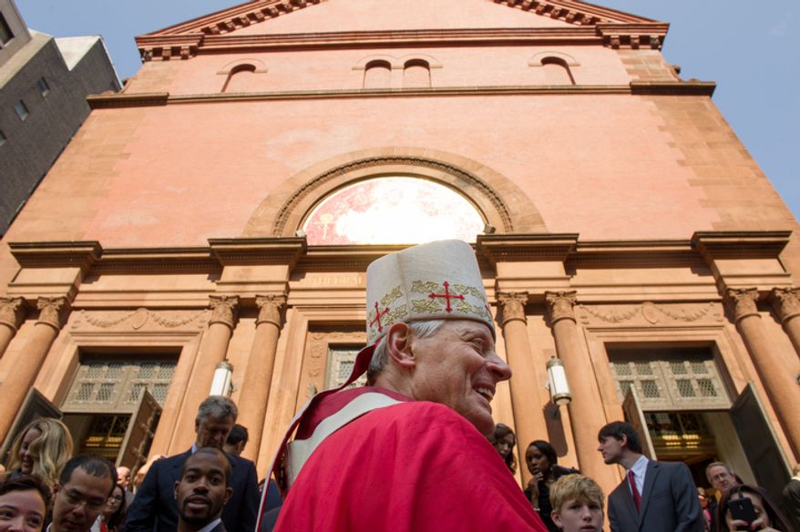 Archbishop of Washington Cardinal Donald Wuerl greets churchgoers following Red Mass at Cathedral of St. Matthew the Apostle. (Andrew Harnik/The Washington Times)