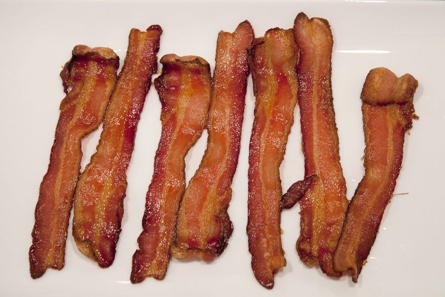 American shoppers should be able to find all the bacon they want on supermarket shelves in the coming months, though their pocketbooks may take a hit. (The Canadian Press, Jonathan Hayward)