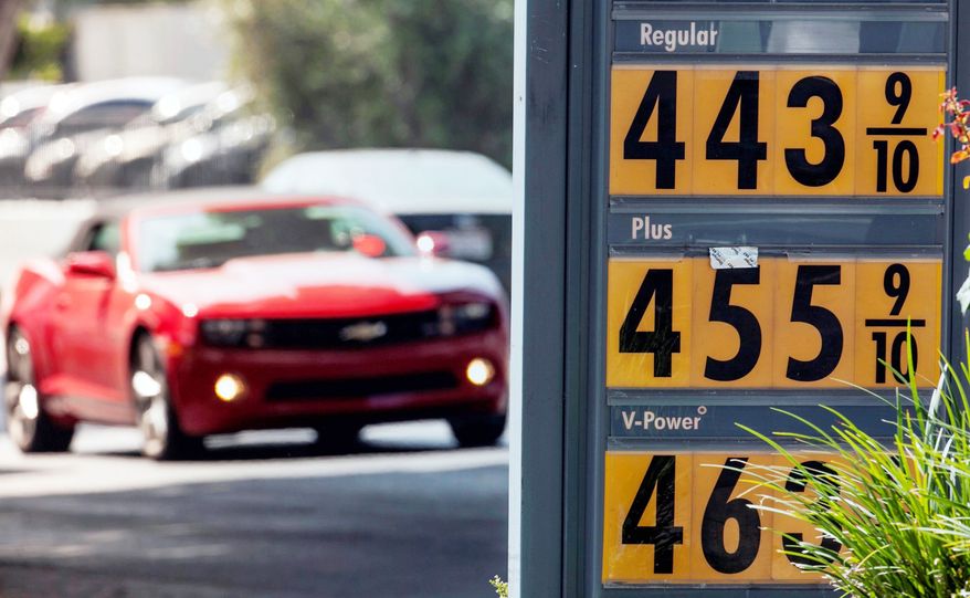 Motorists drive past a gas station in Los Angeles on Thursday. Motorists in California paid an average of $4.232 per gallon Wednesday. That is 45 cents higher than the national average, exceeded only by Hawaii among the 50 states. (Associated Press)