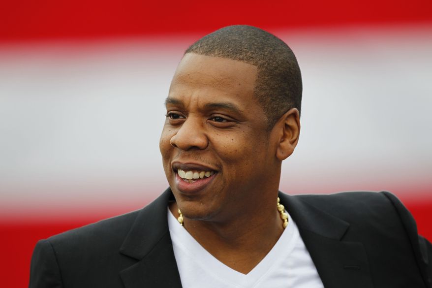 Recording artist Shawn "Jay-Z" Carter smiles during a May 14, 2012, news conference at the Philadelphia Museum of Art in Philadelphia. (Associated Press) **FILE**