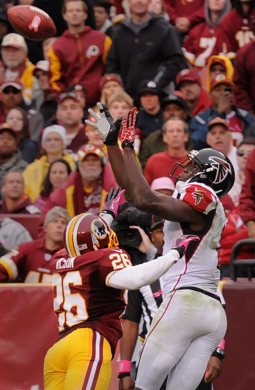 Falcons wide receiver Julio Jones (11) hauls in an 18-yard touchdown pass over Washington Redskins cornerback Josh Wilson (26) in the fourth quarter at FedEx Field, Landover, Md., Oct. 10, 2012. (Preston Keres/Special to The Washington Times)
