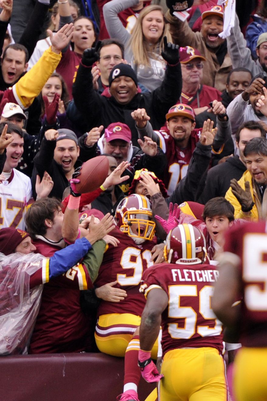 Washington Redskins outside linebacker Ryan Kerrigan (91) celebrates his touchdown after intercepting the ball in the first quarter at FedEx Field, Landover, Md., Oct. 10, 2012. (Preston Keres/Special to The Washington Times)