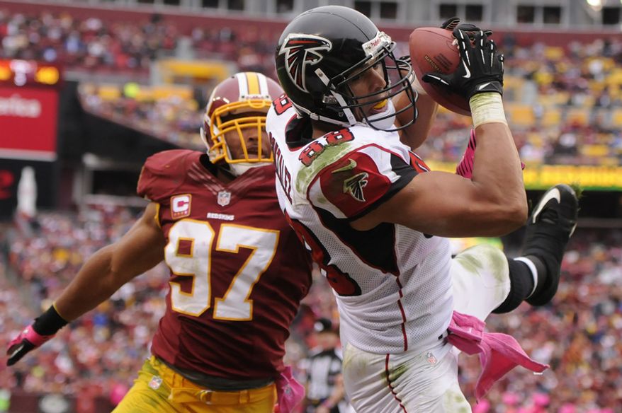 Atlanta Falcons tight end Tony Gonzalez (88) hauls in a second quarter touchdown in front of Washington Redskins linebacker Lorenzo Alexander (97) at FedEx Field, Landover, Md., Oct. 10, 2012. (Preston Keres/Special to The Washington Times)