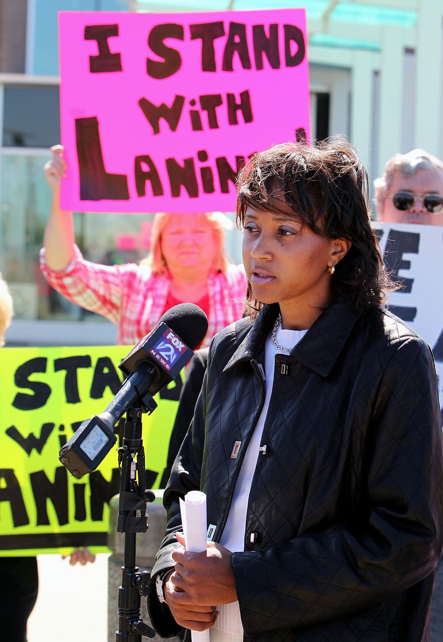 St. Clair County Associate Judge Laninya Cason speaks during a press conference outside the O'Fallon Police Department in O'Fallon, Ill., on Monday, Oct. 8, 2012. (AP Photo/Belleville News-Democrat, Zia Nizami)
