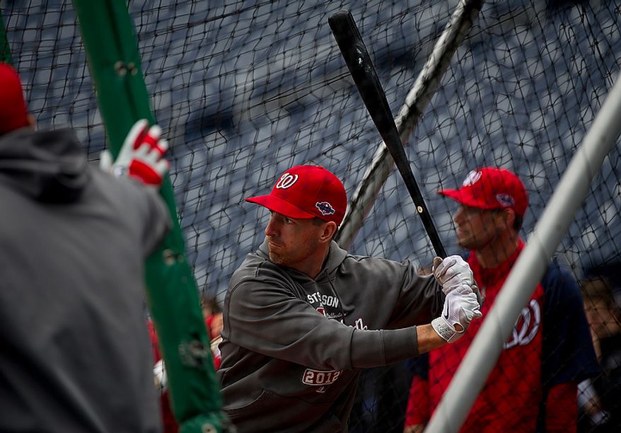 Washington Nationals first baseman Adam LaRoche hits the ball during batting practice at Nationals Park on Tuesday, Oct. 9, 2012. On Wednesday, they play the St. Louis Cardinals at home. (Barbara L. Salisbury/The Washington Times)