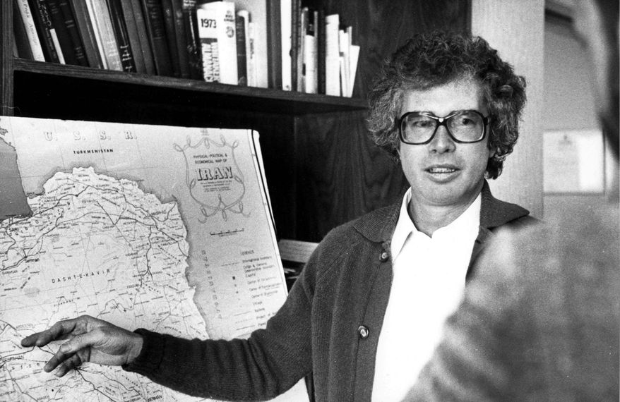 ** FILE ** The Canadian ambassador to Iran, Ken Taylor, briefs reporters on the situation in the mist of the Iran's Revolution in Tehran, a week before leaving the country with six Americans on Jan. 27, 1980. (THE CANADIAN PRESS/Peter Bregg)