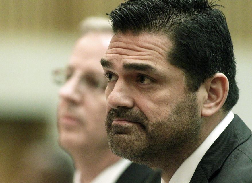 ** FILE ** Los Angeles County Assessor John Noguez (right) speaks before county supervisors at their weekly meeting in Los Angeles on Tuesday, April 10, 2012. (AP Photo/Los Angeles Times, Brian van der Brug)