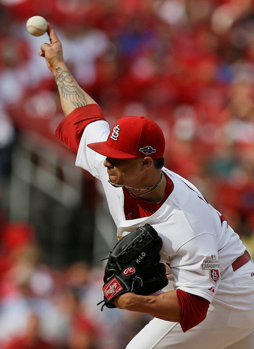 St. Louis Cardinals starting pitcher Kyle Lohse (26) pitches during the first inning of Game 3 of baseball's National League championship series against the San Francisco Giants, Wednesday, Oct. 17, 2012, in St. Louis. (AP Photo/David J. Phillip)