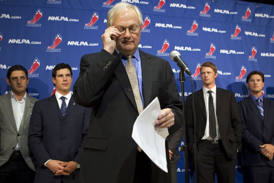 NHL Players' Association executive director Donald Fehr (center) glances at his notes as he stands in front of players, including Pittsburgh Penguins' Sidney Crosby (second from left), following collective bargaining talks in Toronto on Oct. 18, 2012. NHL Commissioner Gary Bettman received three counter-proposals from the players' association on Thursday and left the negotiating table "thoroughly disappointed," further shrinking the possibility of a full hockey regular season. (Associated Press/The Canadian Press)
