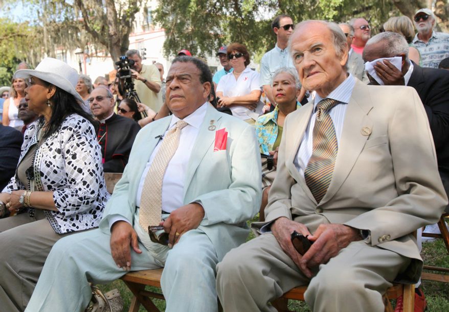 In this June 11, 2011 photo, George McGovern, right, sits next to Andrew Young during the dedication of the Andrew Young Crossing monument in St. Augustine, Fla. A family spokesman says, McGovern, the Democrat who lost to President Richard Nixon in 1972 in a historic landslide, has died at the age of 90. According to a spokesman, McGovern died Sunday, Oct. 21, 2012 at a hospice in Sioux Falls, surrounded by family and friends. (AP Photo/The St. Augustine Record, Daron Dean)