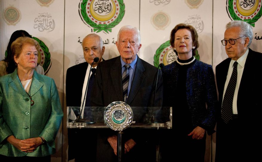 Lakhdar Brahimi (from right), the U.N.-Arab League envoy to Syria; former Irish President Mary Robinson; former U.S. President Jimmy Carter; Arab League Secretary-General Nabil Elaraby; and former Norwegian Prime Minister Gro Harlem Brundtland attend a press conference after their meeting at the Arab League headquarters in Cairo on Wednesday, Oct. 24, 2012. Mr. Brahimi says the Syrian government and some rebel leaders have agreed to a cease-fire during the upcoming four-day Muslim holiday. (AP Photo/Nasser Nasser)