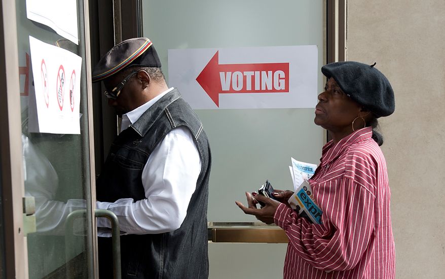 John and Earline McIntyre wait in line to vote early at Judiciary Square in Washington on Wednesday, Oct. 24, 2012. They said they came early to "avoid the crowd" on Election Day. According to site officials, some 2,400 people have voted here since Monday, when the voting opened. The District of Columbia will open seven more early-voting sites on Saturday (one in each ward), which will be open daily except Sundays until Nov. 3 from 8:30 a.m. to 7 p.m. (Barbara L. Salisbury/The Washington Times)