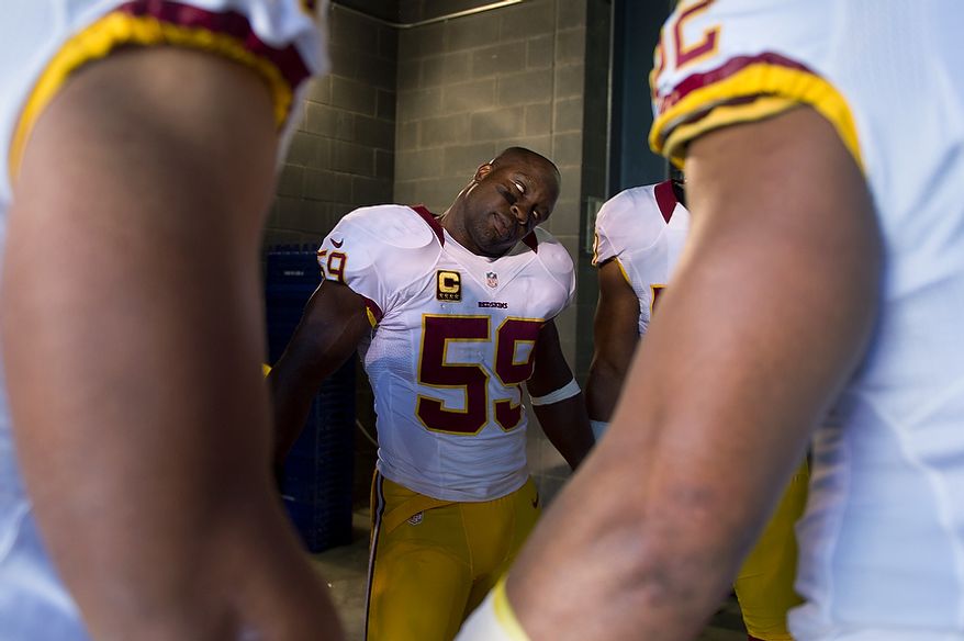 Washington Redskins inside linebacker London Fletcher (59) during the linbacker's pregame prayer before warmups at MetLife Stadium, East Rutherford, N.J., Oct. 21, 2012. (Preston Keres/Special to The Washington Times)
