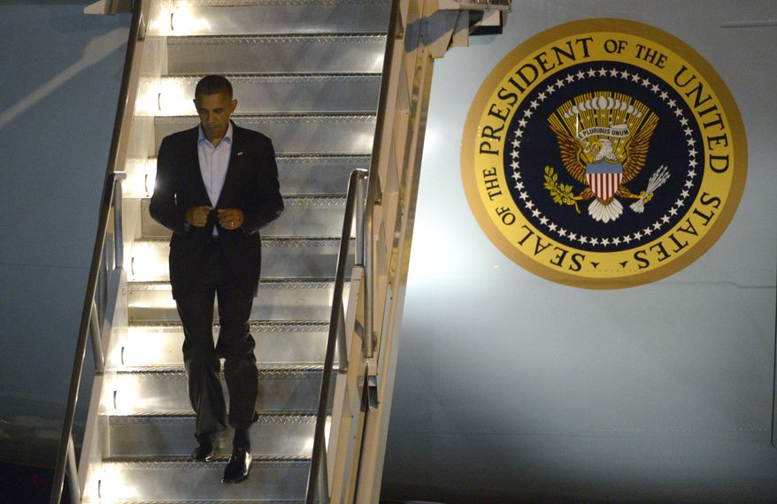 President Obama deplanes from Air Force One after arriving at Orlando International Airport in Orlando, Fla., on Sunday, Oct. 28, 2012. (AP Photo/Phelan M. Ebenhack)