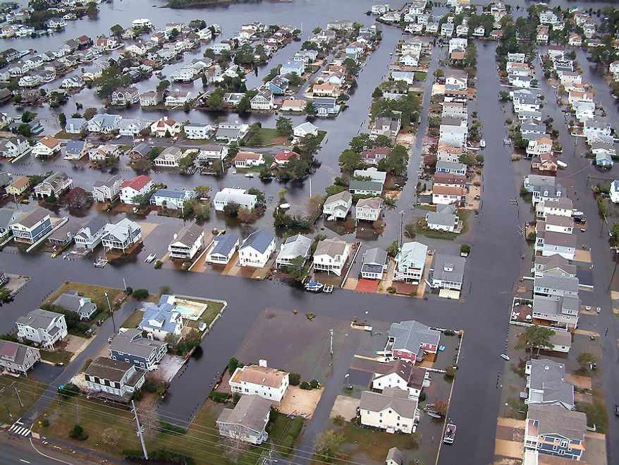 Homes in Fenwick Island, Del. are surrounded by floodwaters from superstorm Sandy on Tuesday, Oct. 30, 2012. Officials said Fenwick Island and nearby Bethany Beach appeared to be among the hardest-hit parts of the state. Gov. Jack Markell lifted the state of emergency on Tuesday in New Castle and Kent counties, but has kept the order in place for Sussex County because some areas remain flooded from superstorm Sandy. (AP Photo/Randall Chase)