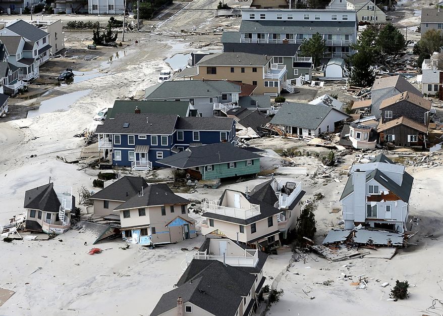 This aerial photo shows destroyed houses left in the wake of superstorm Sandy on Wednesday, Oct. 31, 2012, in Seaside Heights, N.J. (AP Photo/Mike Groll)