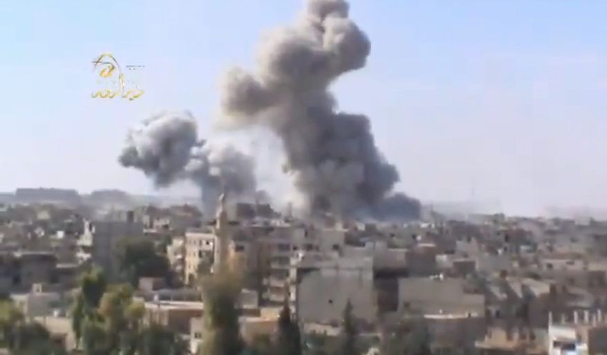 This image taken from video obtained from the Ugarit news network, which has been authenticated based on its contents and other AP reporting, shows smoke rising following heavy bombing from military warplanes in Deir el-Zour's Jbeileh neighborhood, 450 km northeast of Damascus, Syria, on Monday, Oct. 29, 2012. Syrian warplanes launched 60 airstrikes against rebel targets around the country on Monday, the most intense air raids across the country since the uprising began 19 months ago, according to anti-regime activists. Activists said at least 500 people were killed over the four-day period ending Monday when a U.N.-backed truce was supposed to be in effect. They said the death toll for Monday so far has reached 80. (AP Photo/Shaam News Network via AP video)
