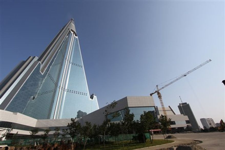 In this Sept. 23, 2012, photo released by Koryo Group on Wednesday, Sept. 26, 2012, the pyramid-shaped, 105-story Ryugyong Hotel stands in Pyongyang, North Korea. A foreign tour agency said the interior of the massive hotel in the North Korean capital remains unfinished. Beijing-based Koryo Tours got a sneak peek inside the hotel, which has been an off-limits construction site and remains a source of fascination for the outside world. (AP Photo/Koryo Group)