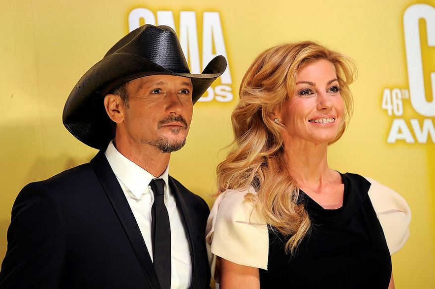 Tim McGraw, left, and Faith Hill arrive at the 46th Annual Country Music Awards at the Bridgestone Arena on Thursday, Nov. 1, 2012, in Nashville, Tenn. (Photo by Chris Pizzello/Invision/AP)