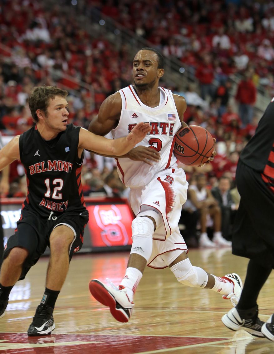 N.C. State's Lorenzo Brown drives to the basket against Belmont Abbey's Justin Kuhlman during the first half of a preseason NCAA college basketball game in Raleigh, N.C., Saturday, Nov. 3, 2012. N.C. State won 105-80. (AP Photo/Ted Richardson)