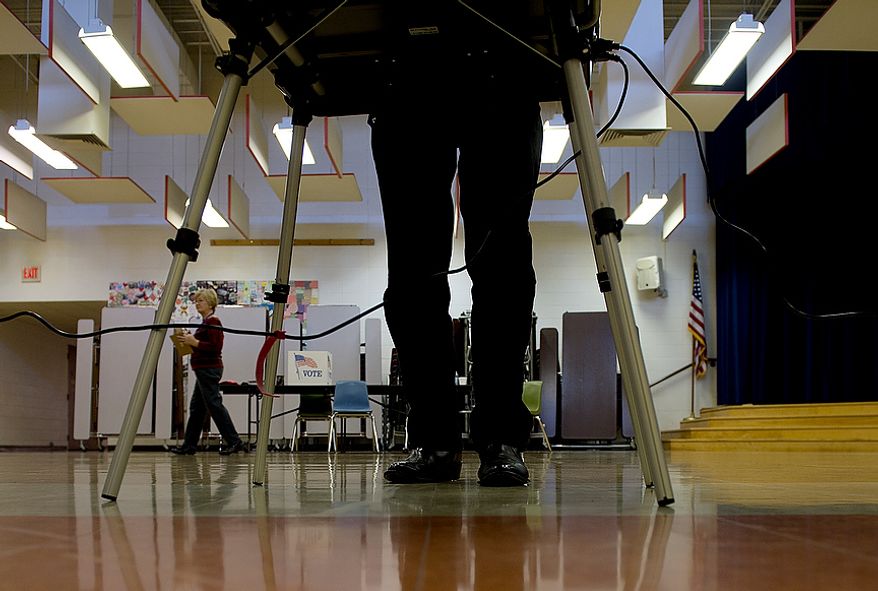 A voter casts his ballot on Election Day at Grantsville Elementary School in Grantsville, Md., on Nov. 6, 2012. (Barbara L. Salisbury/The Washington Times)