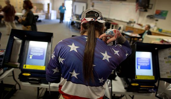 Victor "Snake Mann" Wolder, marks his choices while voting during Election Day, Tuesday, Nov. 6, 2012, in Las Vegas. (AP Photo/Julie Jacobson)
