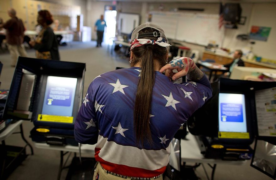 Victor "Snake Mann" Wolder, marks his choices while voting during Election Day, Tuesday, Nov. 6, 2012, in Las Vegas. (AP Photo/Julie Jacobson)
