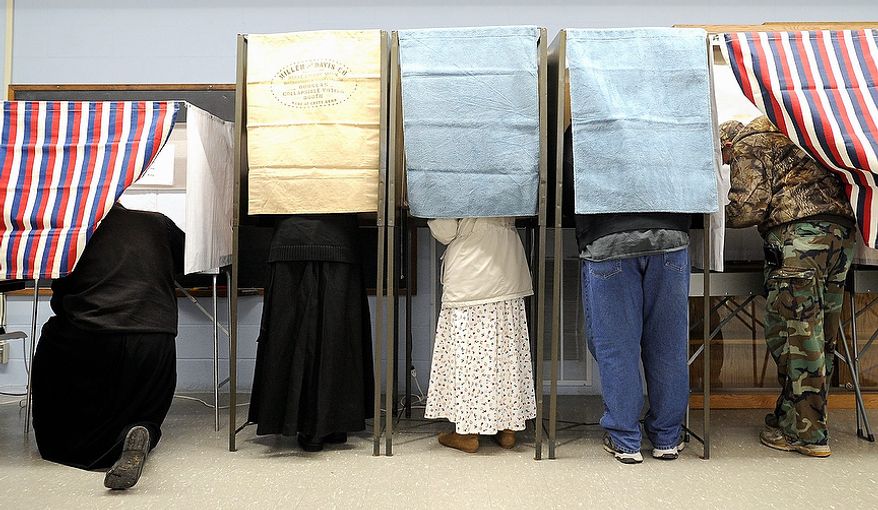 Citizens fill the voting booths on Tuesday, Nov. 6, 2012, at the Stockton Community Center in Stockton, Minn. After a grinding presidential campaign, Americans headed into polling places across the country. (AP Photo/Winona Daily News, Andrew Link)