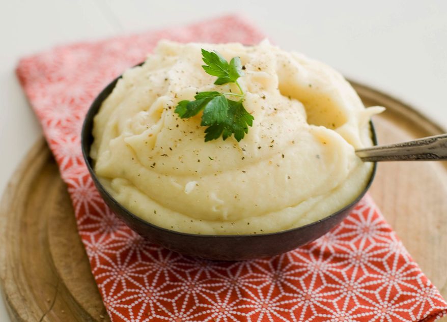 Dinner guests could well mistake pureed parsnips for mashed potatoes. The trick is to save the liquid in which the parsnips are cooked, boiling it down until it becomes syrupy, then adding it back to the puree. (Associated Press)