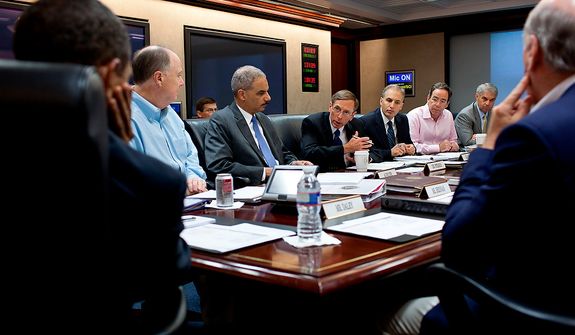 **FILE** President Obama listens as CIA Director David Petraeus makes a point during a national security meeting in the Situation Room of the White House. (Rex Features via Associated Press)