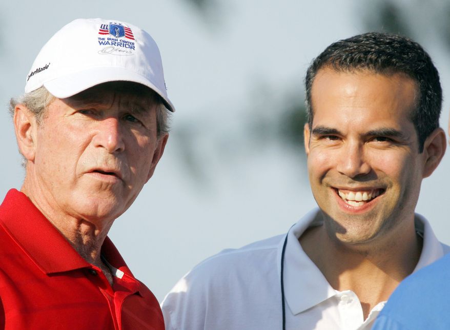 Former President Bush watches golf in Irving, Texas, with his nephew, George P. Bush, 26, who has made a campaign filing in Texas that is required of anyone planning to run for state office, though he did not have to specify what office. The son of former Florida Gov. Jeb Bush is a graduate of the University of Texas law school who now runs a real estate investment firm and a consulting firm in Texas. (Associated Press)