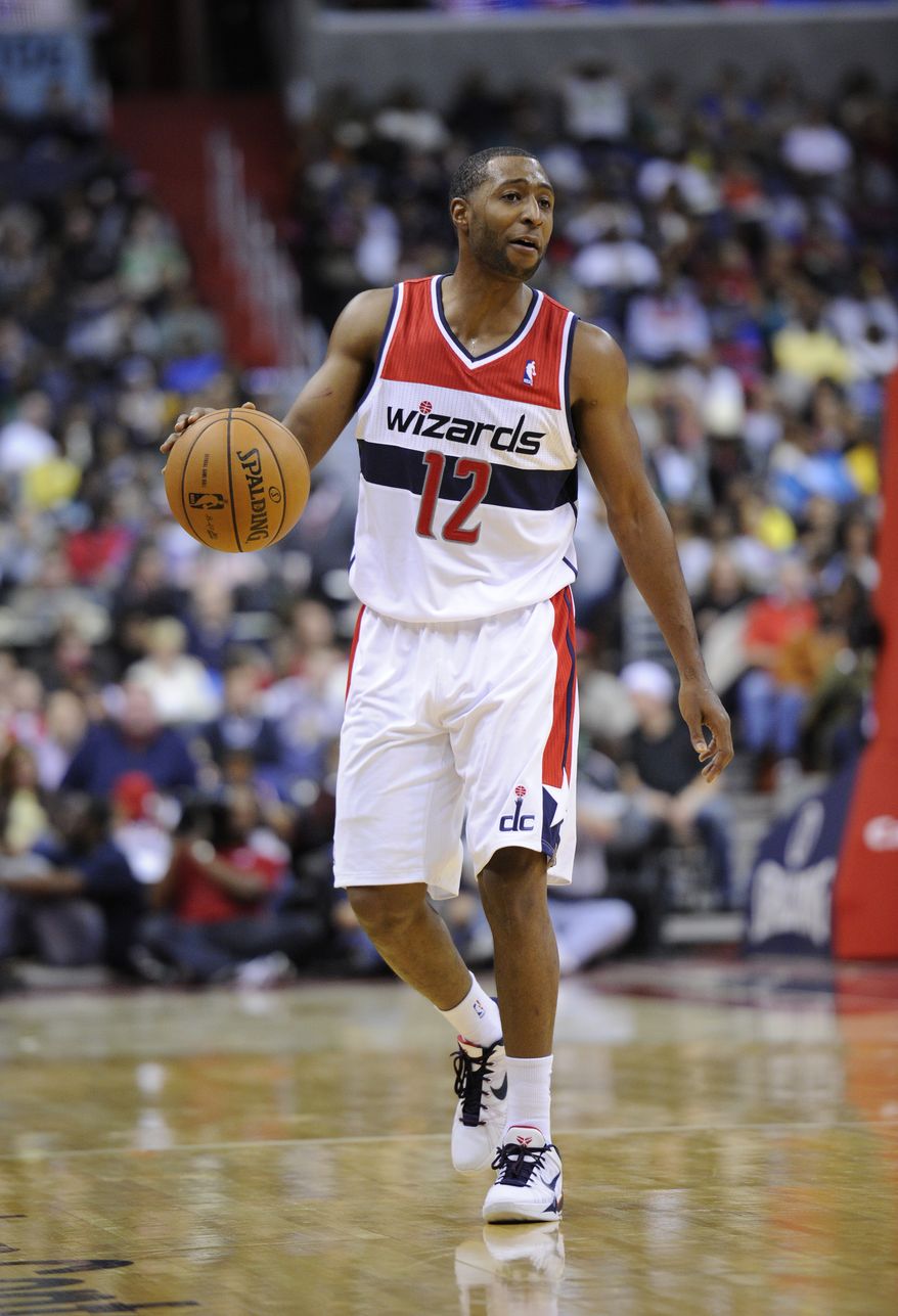 Washington Wizards point guard A.J. Price (12) dribbles the ball against the Boston Celtics during the second half of an NBA basketball game, Saturday, Nov. 3, 2012, in Washington. The Celtics won 89-86. (AP Photo/Nick Wass)