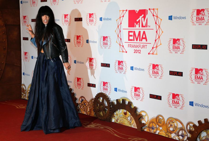 Swedish singer-songwriter Loreen arrives on the red carpet of the 2012 MTV European Music Awards show at the Festhalle in Frankfurt, central Germany, Sunday, Nov. 11, 2012. (AP Photo/Frank Augstein)
