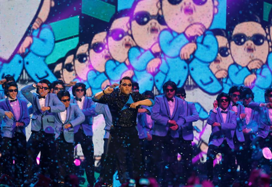 South Korean Psy performs during the 2012 MTV European Music Awards show at the Festhalle in Frankfurt, central Germany, Sunday, Nov. 11, 2012. (AP Photo/Michael Probst)