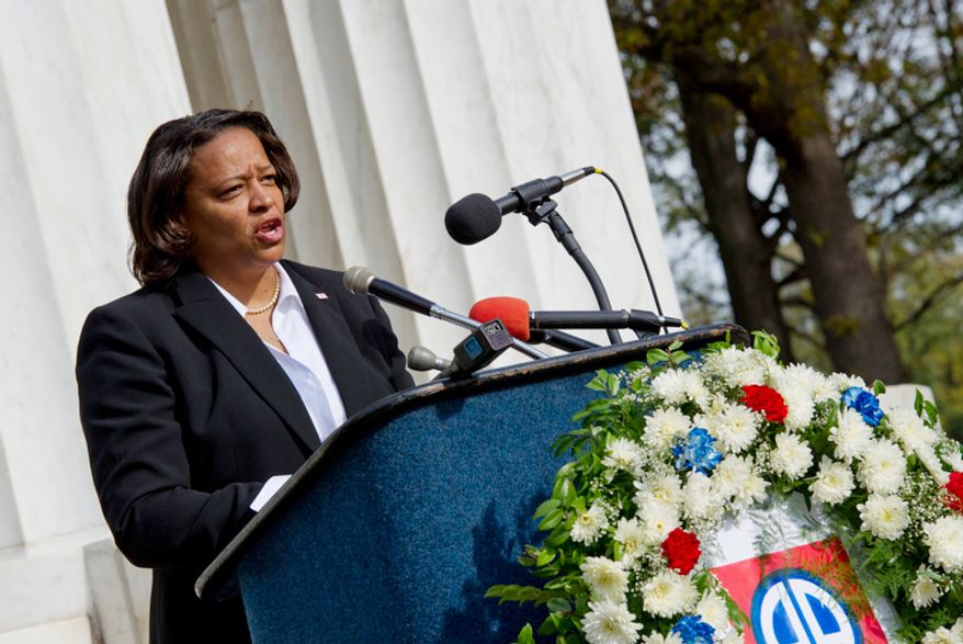 Tomi Rucker, a Washington, D.C. Navy mom, says she was "saddened" when the D.C. flag was not a part of her son's boot camp graduation, particularly because the flags of the other recruits' states were. She came to the D.C. World War I Memorial on Monday, Nov. 12, 2012 to talk about the inconsistent flying of the D.C. flag at military graduations. (Barbara L. Salisbury/The Washington Times)