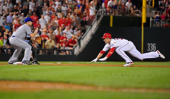 Bryce Harper slides in to third base in the bottom of the tenth inning during the Washington Nationals game against the New York Mets at Nationals Park, Washington D.C.,Tuesday, July 17, 2012. Harper's triple allowed Jhonatan Solano to score tying the game at 4-4. (Ryan M.L. Young/The Washington Times)