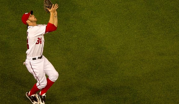 Washington Nationals right fielder Bryce Harper (34) catches a fly ball in left field as the Washington Nationals lose to the Arizona Diamondbacks 5-1 in Major League Baseball at Nations Ballpark, Washington, D.C., Tuesday, May 1, 2012. (Andrew Harnik/The Washington Times)